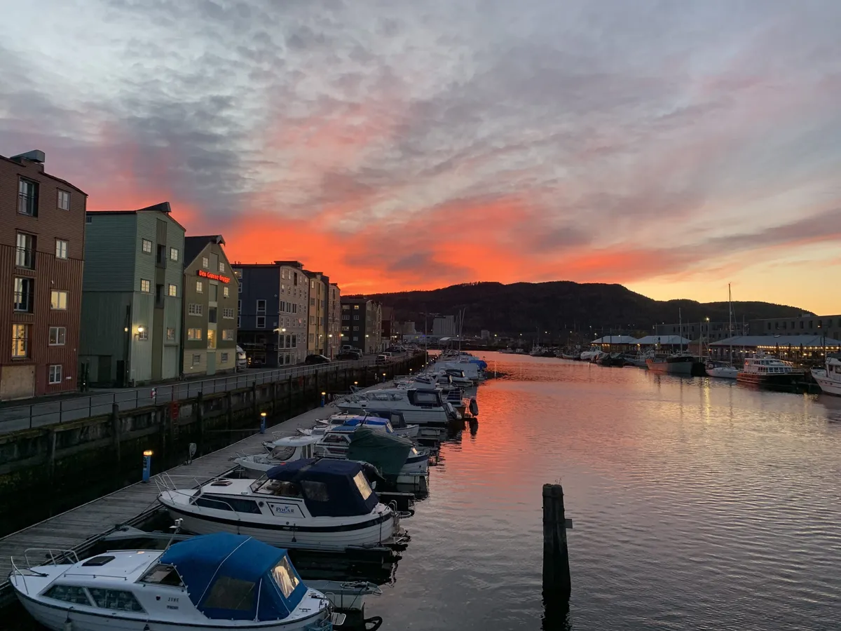 Orange sunset over a Norwegian harbour
