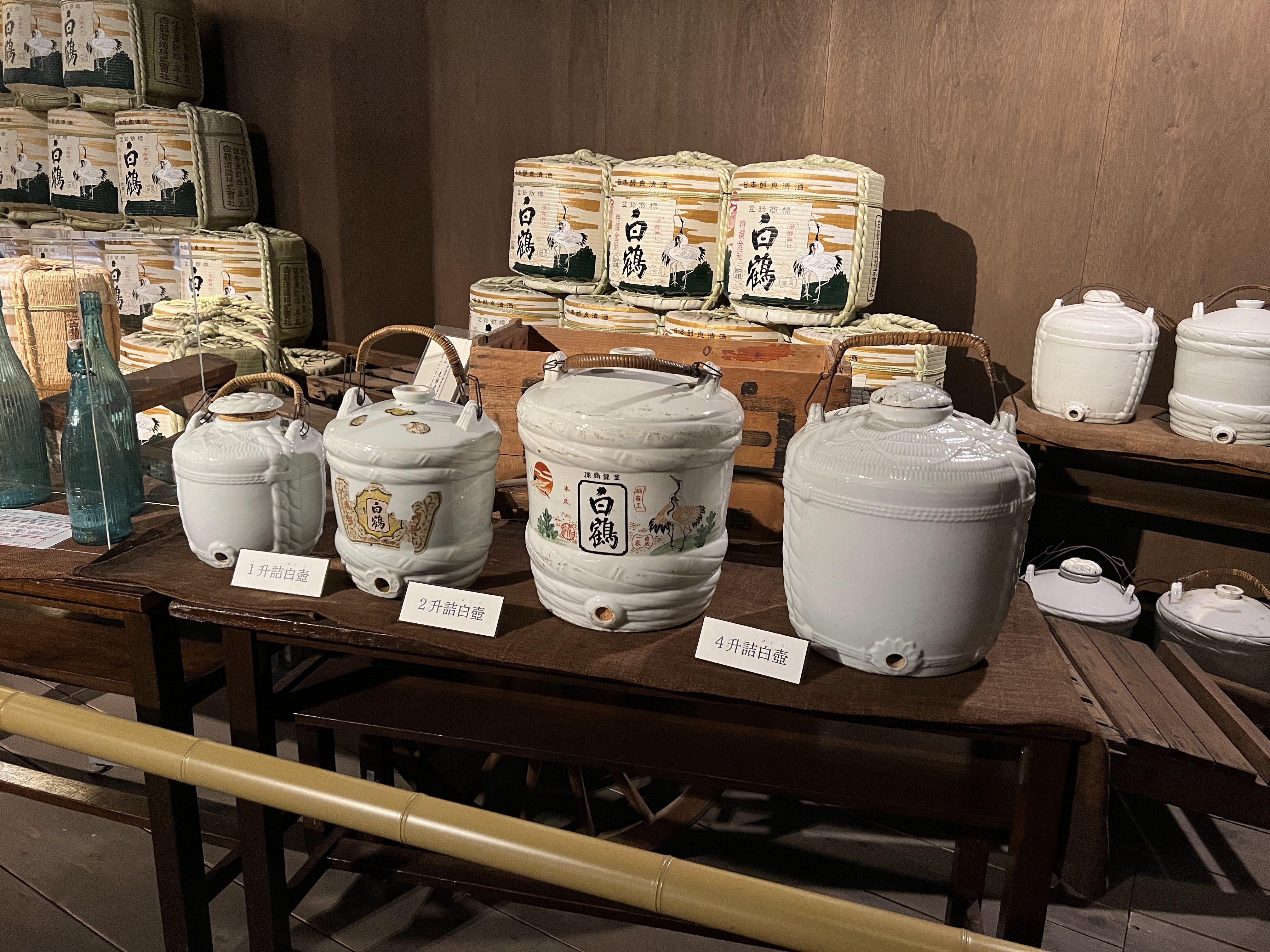 Old sake barrels in a museum exhibit