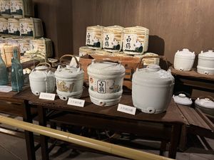 Old sake barrels in a museum exhibit